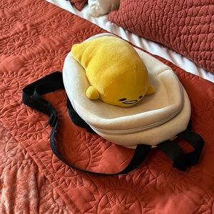 Loungefly Gudetama plush backpack.